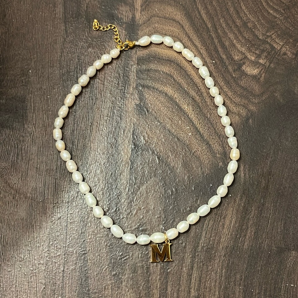 Fresh water pearl necklace with M initial.
